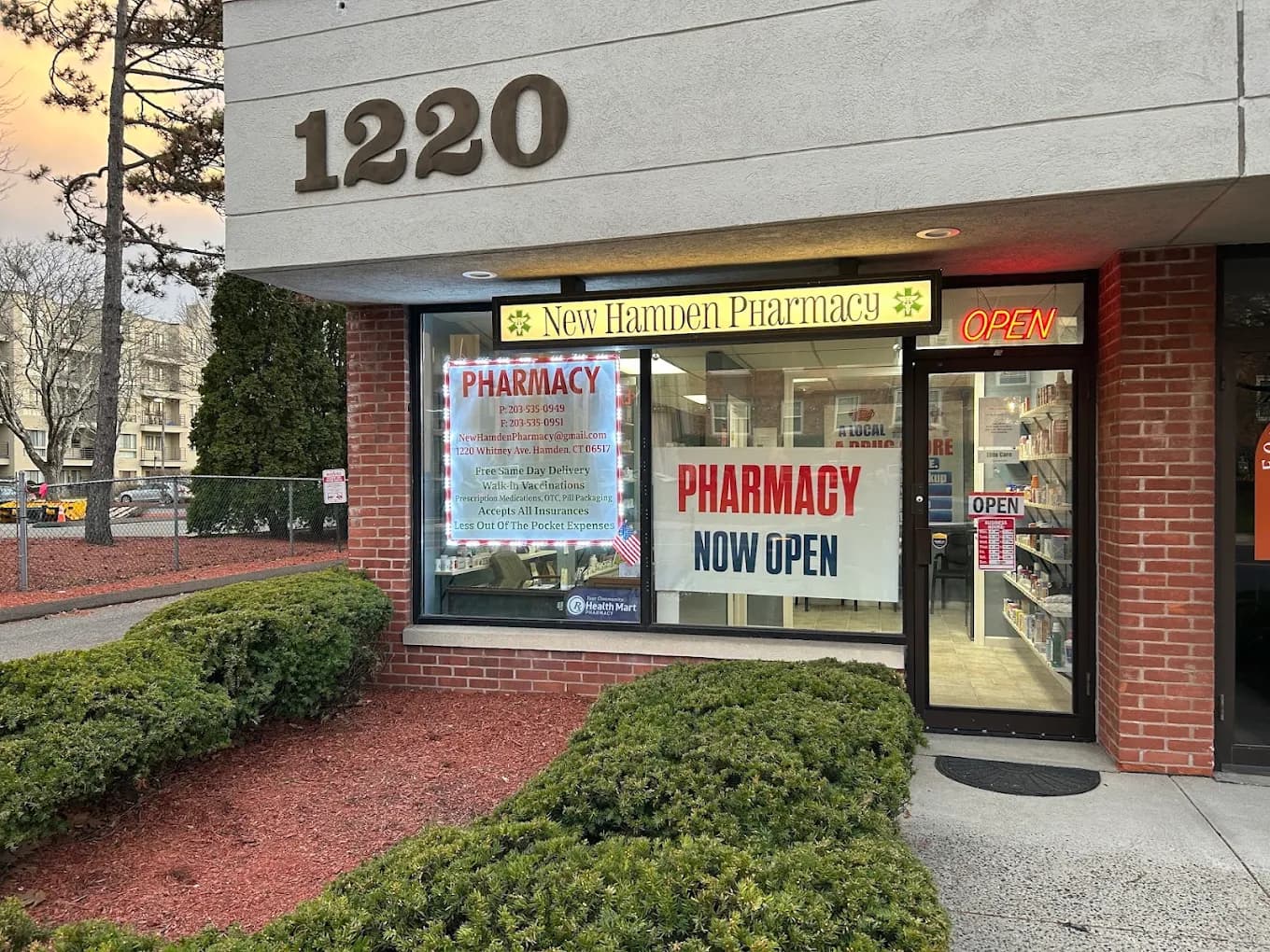 Pharmacist consulting with a patient at counter